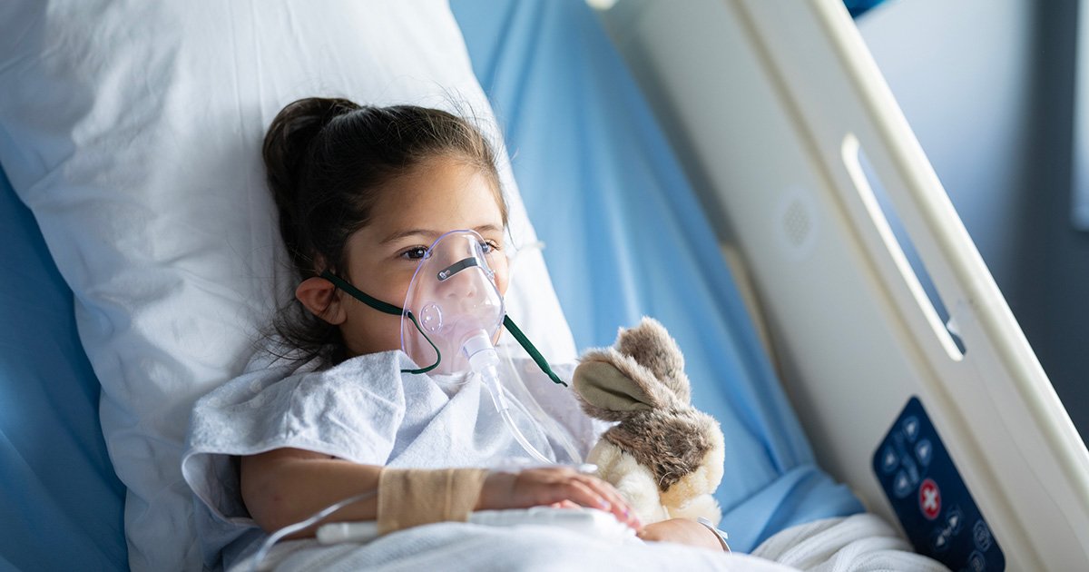 child in hospital bed with oxygen mask child in hospital bed with oxygen mask
