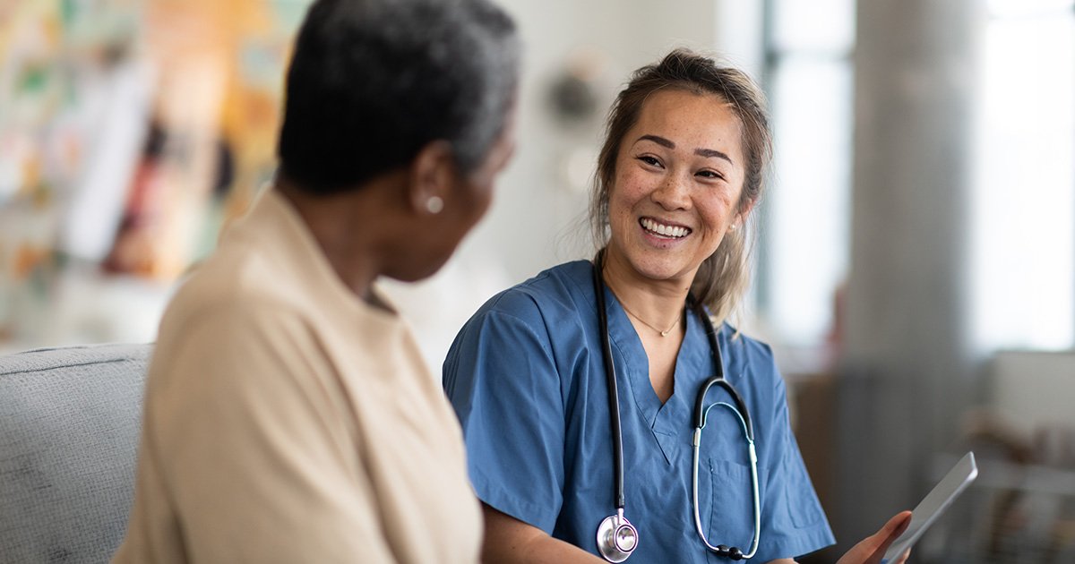 healthcare provider and patient going over information healthcare provider and patient going over information