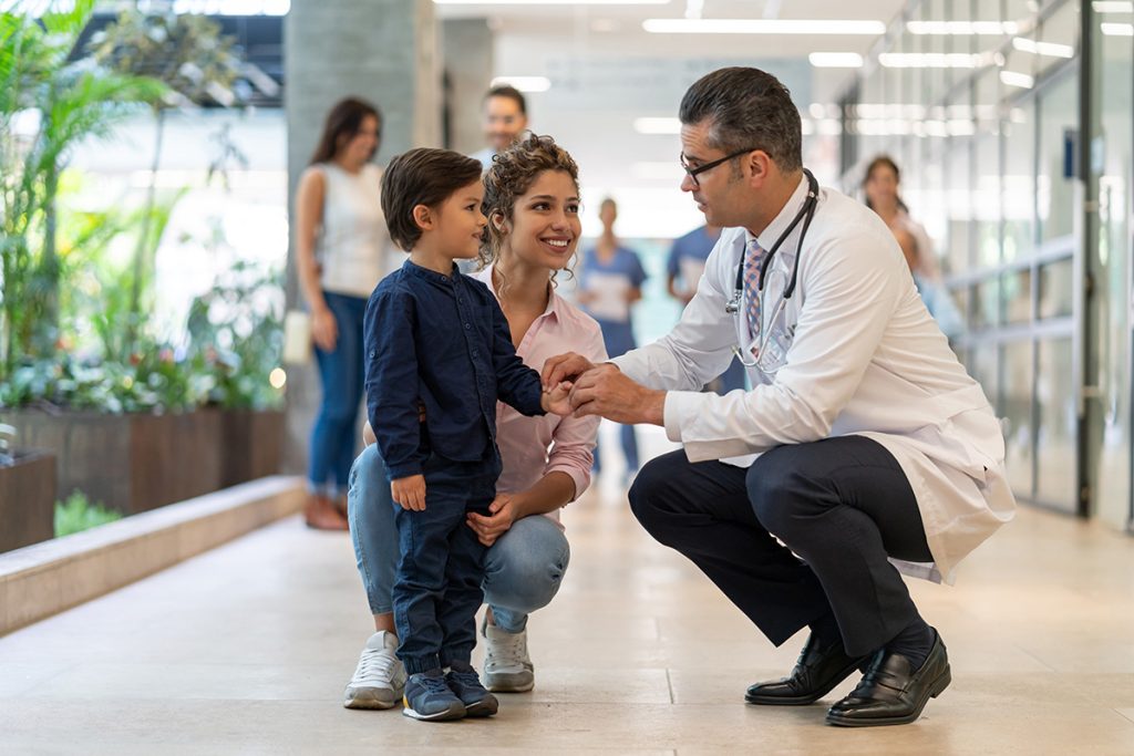 physician with mother and child